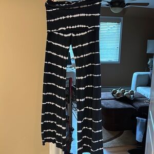 Black and white striped flare yoga pants with a fold over band